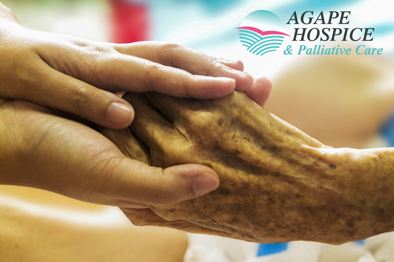 Two hands hold a hospice patient's hand in Torrance, CA.
