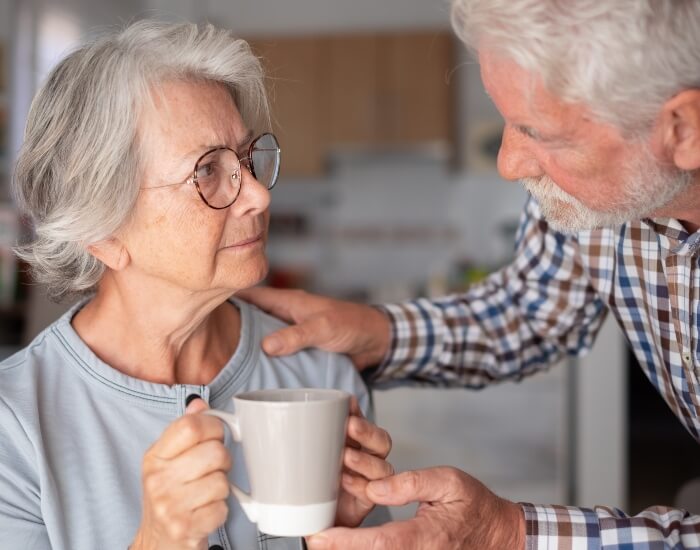 A woman being taken care of by her husband and hospice care in Torrance, CA.