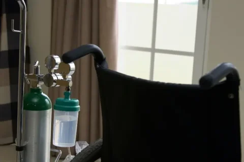 Oxygen tank next to a wheelchair