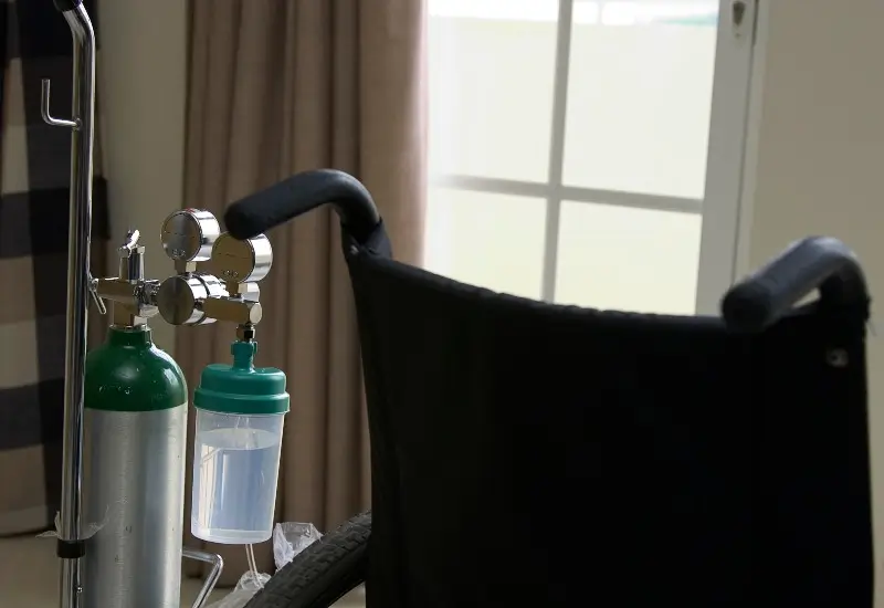 Oxygen tank next to a wheelchair
