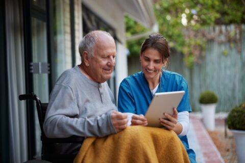 Hospice care provider reviewing information with a stroke patient in Los Angeles & Orange Counties